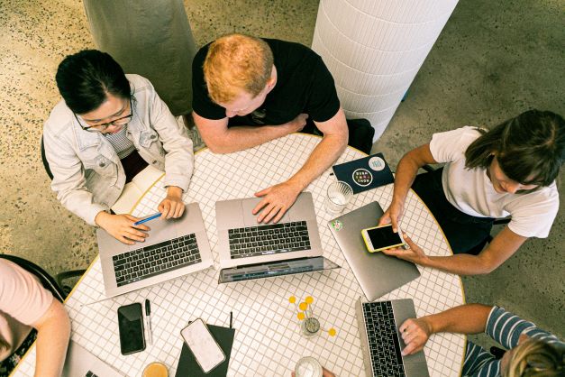 Students preparing marketing proposal for dissertation.